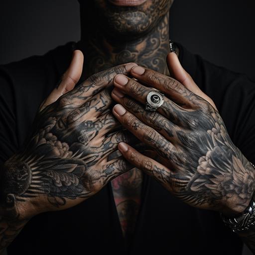 : Birdman hands rubbing. extreme closeups of black man's hands with tattoos studio lighting shot on a long lens. bosozoku