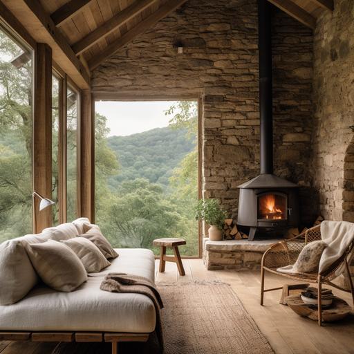cozy interior of a tiny stone cabin in Cantabria valley, 5m high roof, Stone, raw oak wood, White walls, minimal, wabi-sabi, nordic higge, firepit, big Window and linen sofa