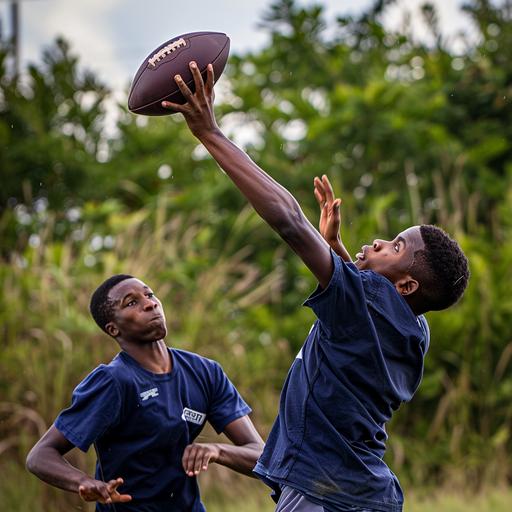 Black teen boy catching a football over another black teen boy, they are both wearing Navy Blue t-shirts and Navy blue shorts, photo realistic, natural lighting s750, dslr camera --v 6.0