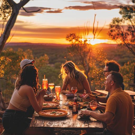 people sitting around having a good time drinking beers and cocktails and eating pizzas at Gorge View Bush Retreat on the sunset deck as the sun goes down. There is the colours of outback Australia, Northern territory and the Top end in the air. The people are good looking, and dressed for warm weather, but are fully clothed. The sunset deck is located on top of a hill, looking over the Katherine river, the trees are small and typical of the Northern Territory near Katherine in the Top End. There is a kapok tree with yello flowers visible in the background