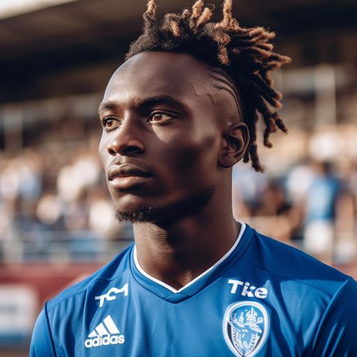 Football player on the pitch, CD Tenerife Uniform, Black Skin, Medium Length Hairstyle, 172cm, 60kg, taken with EOS R 300mm f2.8, realistic, Only the upper body, front face view, zoom shot, stadium with full crowd as background, day match --v 5.0 --s 750