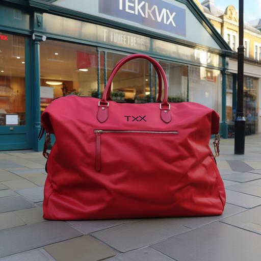 a large red TK Maxx bag, on a red plinth, in Covent Garden