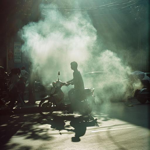 A young man pushing his bike as he walks along due to scooter breakdown on the streets under the hot sun, the smoke comming from motorbike exhaust pipe --v 6.0