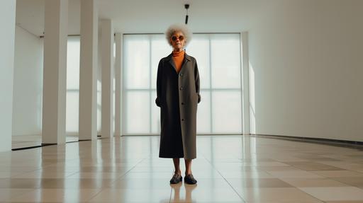 Balenciaga model full-length portrait shot in a bright, spacious European-style gallery Korean female model in her 70s with glasses Afro hair with plenty of headroom --ar 16:9 --upbeta --q 2 --s 750 --v 5
