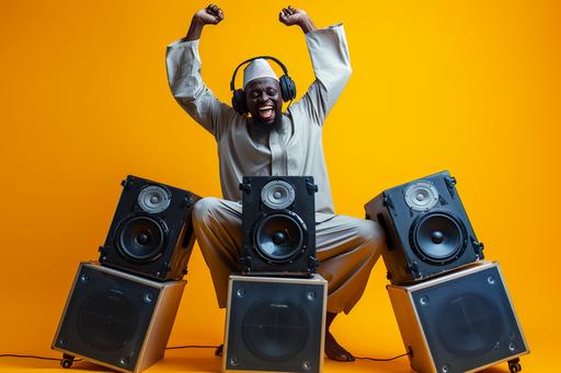 Dramatic low angle shot of full body shot of cool black Muslim man, wearing African Muslim attires, excited, happy, fun, energetic, relaxed leaning on 3 huge speakers, with huge headphones, laughing, smiling into the camera, in a studio photoshoot in Lagos --ar 3:2 --v 6.0 --s 50