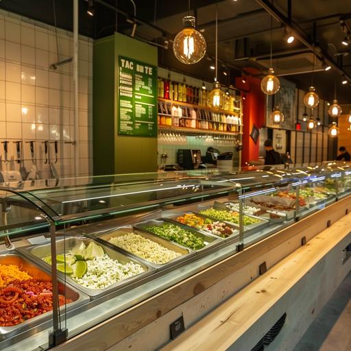 It sells tacos, burritos, and salads. It is structured so that customers can choose each filling while watching the showcase, and the whole is composed of to-go. The background color of the store is white and green, with bright light bulbs. it looks bright.