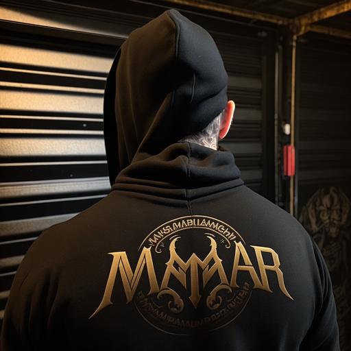 MAB logo printed on the back of black hoody