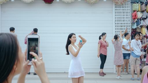 The background is a clean outdoor market that is not outdated, The season is summer, Front view, There is a shutter door that is large enough to fill the screen, and the shutter door is white, People of various races pass by in front of the shutter door, Some people take pictures in front of the shutter door, A Korean woman takes a selfie with her phone in front of the shutter door --ar 16:9 --v 6.0 --no letter