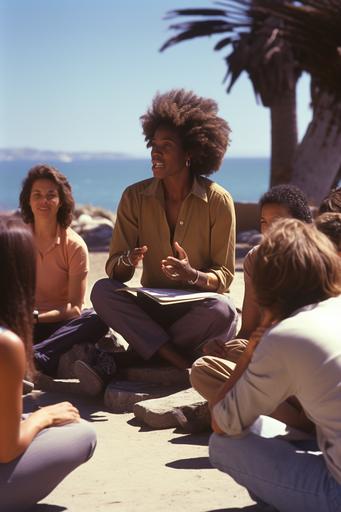 a black woman is teaching another adults in a plaza, in front of a beach. The students are sitting arrownd the woman, listening with attention all the informations. All they are happy. She is wearing a purple tshirt, looking like an 1970 woman. Use wide angle, grainy photo style, 1970s era and a day light mode. Use yellow gold collor only in the details --ar 2:3