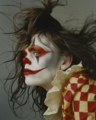 a clown with long hair wearing fake make up, in the style of tim walker, janet delaney, hiroshi sugimoto, light yellow and dark red, manticore, eye-catching --ar 51:64