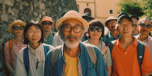 a group of very funny japanese turists in sardinia, wes anderson style, 55 year old ages, happy they look into the camera; colored t-shirts, fun gift stuff, anamorphic lens, hyper realistic, super detailed, playful, nice cinematic light, great atmosphere, film grain, shot with Alexa 35mm, film by Judd Apatow, lens flare f 2.4 --ar 2:1 --s 750 --v 5
