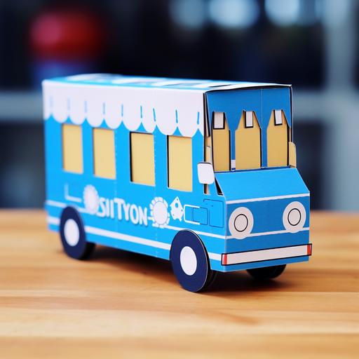a paper bus made by a milk box, blue and rectangular milk box