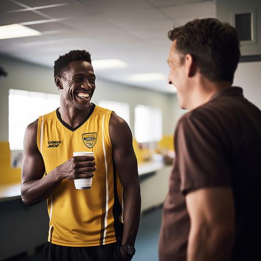 an australian football player is standing in the clubrooms talking to his coach, they are both smiling and and the ocach has his hands on the players shoulder, shot in the style of a Sony A7iv f2.8 18-24