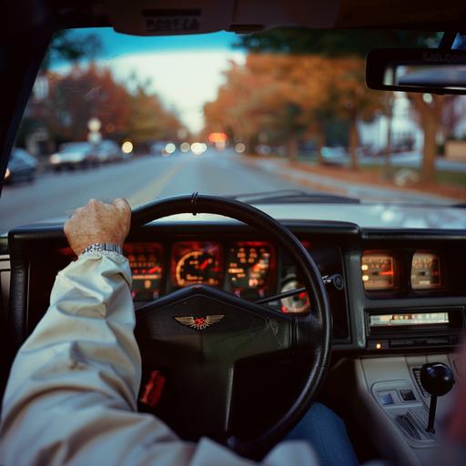 /cinematic, professional photo from the inside of a 1987 white trans am, from the drivers point of view, looking down at the manual shift as a hand reaches for the shifter, William eggleston style, arriflex 35 bl camera, canon k35 prime lens ar 16:9 raw style v 6.0