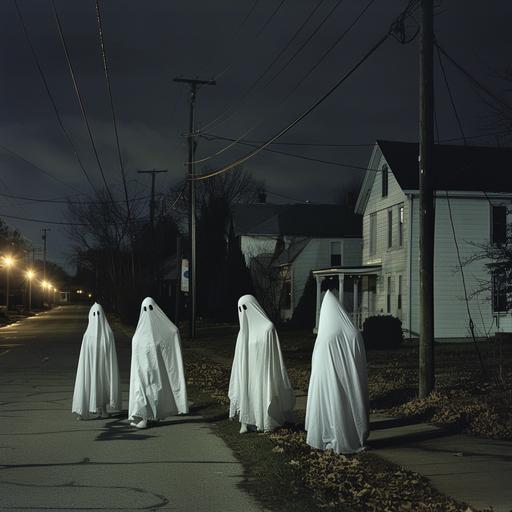 color photograph of teens wearing sheet ghost costumes at night in a small town neighborhood, realistic lighting, symbol, --v 6.0