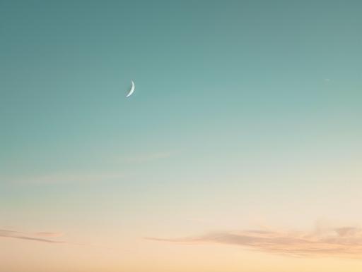 minimal scenic view of sunset sky with moon, ivory/blue color palette, muted colors, simple, ethereal, no clouds, no sun --ar 4:3 --v 6.0