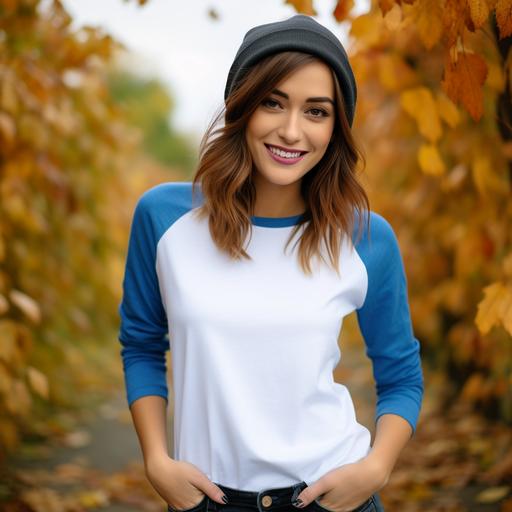 attractive woman in her 20s wearing a blank white and blue raglan 3/4 sleeve shirt smiling, autumn themed background