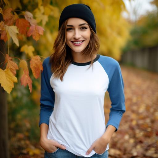 attractive woman in her 20s wearing a blank white and blue raglan 3/4 sleeve shirt smiling, autumn themed background