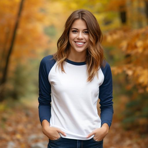 attractive woman in her 20s wearing a blank white and blue raglan 3/4 sleeve shirt smiling, autumn themed background