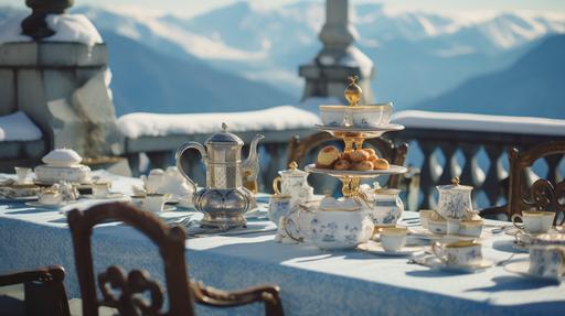 old money aesthetic, wide depth of field at an angle, fancy long table with many vintage rattan cane bistro chairs, full high tea spread, many cups of hot tea, steam wafting up into the air, tea in a luxurious blue and white bone china high tea set with gold accents on a stately majestic stone rooftop terrace with the snow-covered mountains of the Swiss Alps in the background, sony a7s, --ar 16:9