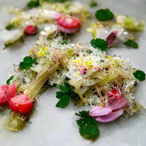 garlic, freshly grated parmesan, leeks, tomato confit and it’s oil and topped with big shavings of parmesan and radish flowers.