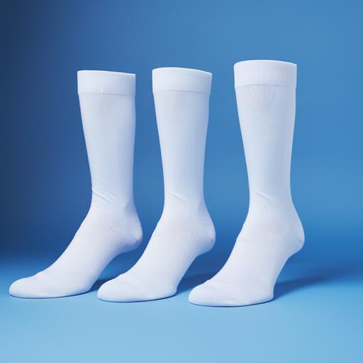 photograph of three blank crew white socks