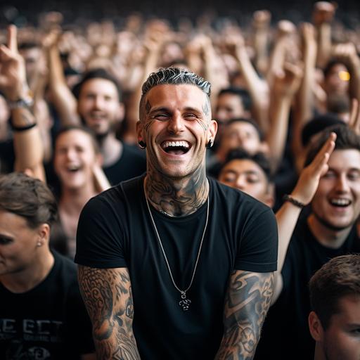 guy with tattoos, in the crowd at a music concert, wearing a blank black t-shirt, having fun