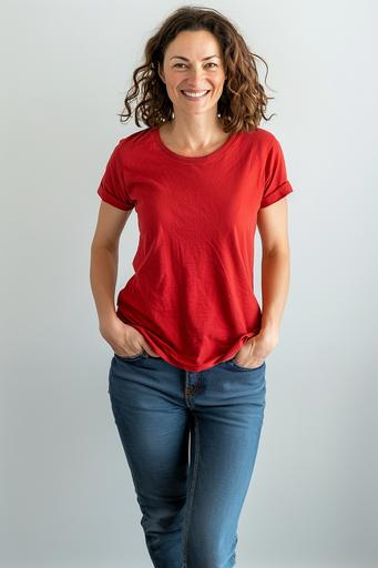 white woman wearing a loose fitting red t-shirt and jeans, she is smiling, she has is up, white background --ar 2:3