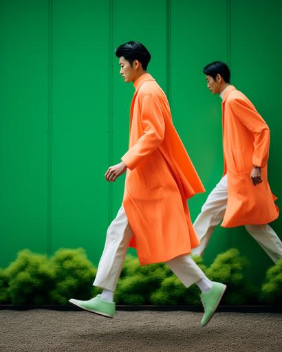 wide shot of Japanese men in sartorial neon color summer coats running passed huge minimalist exotic sartorial fabric garden by elsa bleda, minimal figures --ar 4:5 --stylize 50 --v 5.2