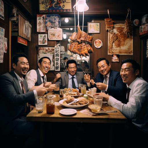 At an izakaya, around 20 salarymen are merrily enjoying a course meal at the restaurant's table seating. They're sipping on highballs and sours. The course includes potato salad, edamame with pepper, cream cheese, minced meat eggplant (Nasu Kiyma), a mixed skewer platter, grilled udon, and tapioca milk tea.